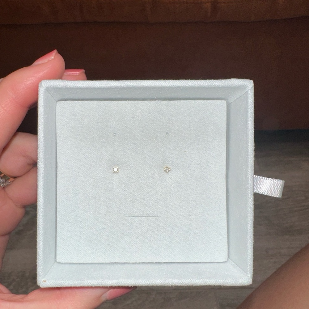 Solitaire diamond stud earrings